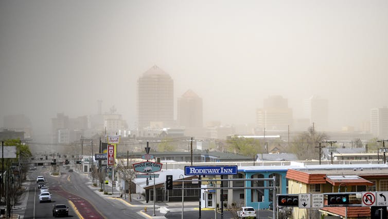 Downtown is barely visible through a haze of dust.