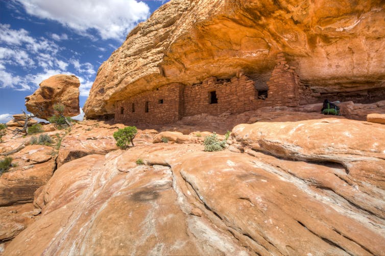 Cliff dwellings under the rim of a cliff