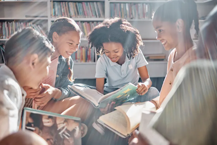 Children reading in library