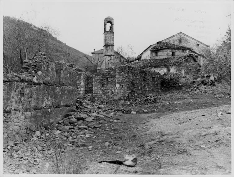 Black-and-white image of a destroyed town center