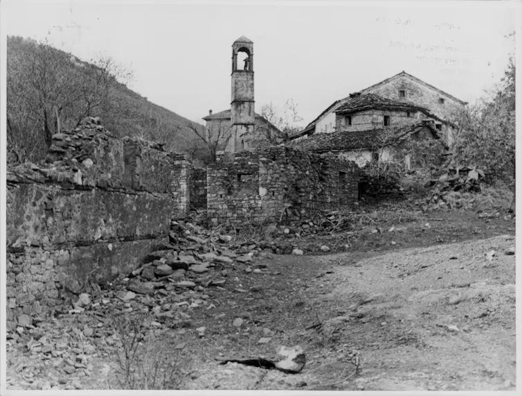 Black-and-white image of a destroyed town center