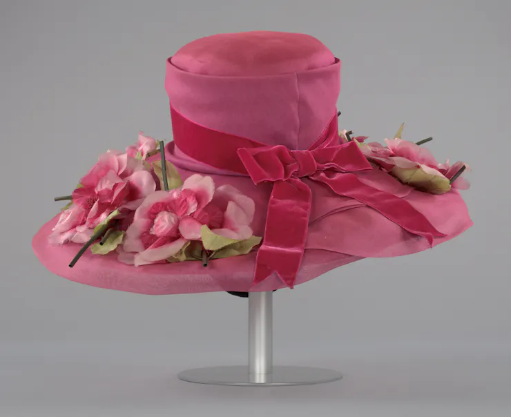 Large pink women's hat with dark pink bow and pink flowers