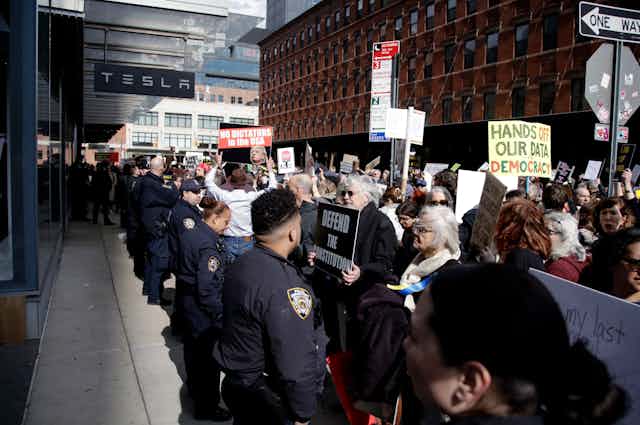 Protest outside Tesla dealership