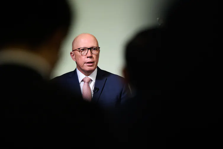 Opposition leader Peter Dutton speaks to the media at an event.