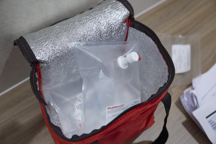 A cooler bag filled with plastic bags that have air in them.