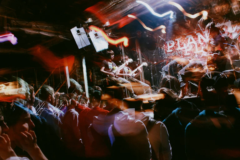 A blurry photo of a band in a pub.