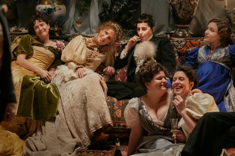 Film still: a gathering of friends at a party in 20th century France.