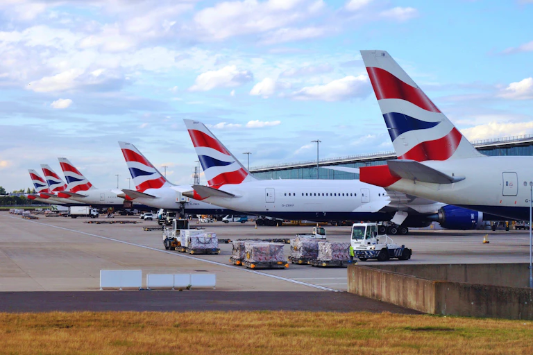 british airways aircraft lined up on the tarmac at heathrow airport