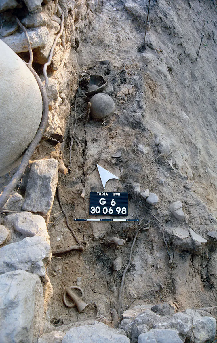 Excavations showing a drinking vessel in the ground