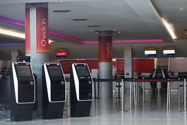 empty automated check-in areas at heathrow airport