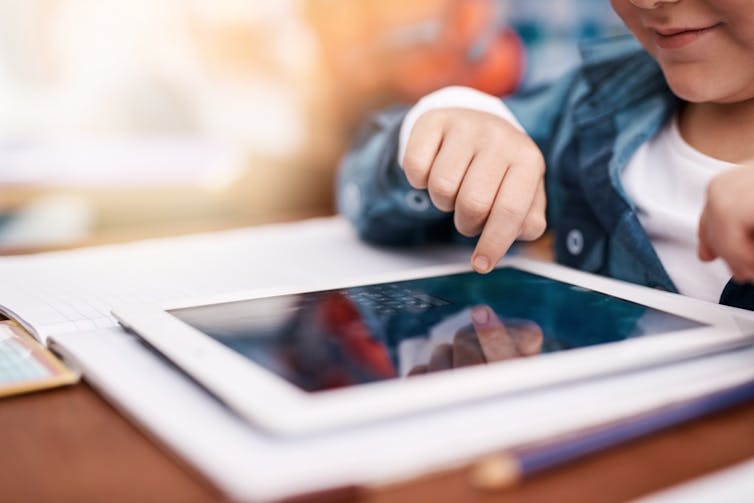 Discover ways to learn with AI, revolution or phantasm? 1 Tablet, school and children's hands in class for online learning, study and knowledge