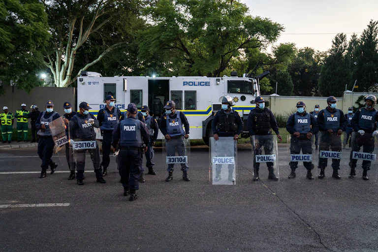 Men in police uniform and riot gear
