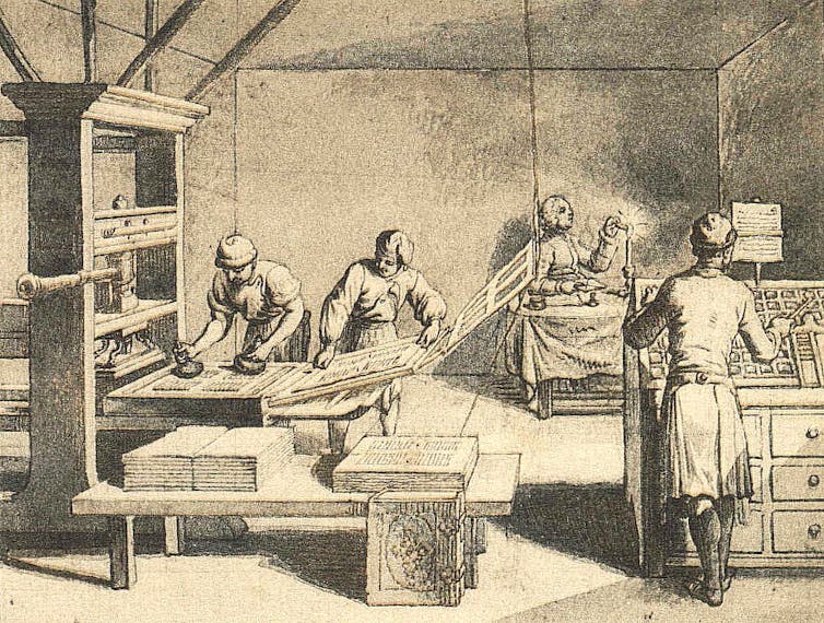 Black and white drawing of people in a room using a printing press.