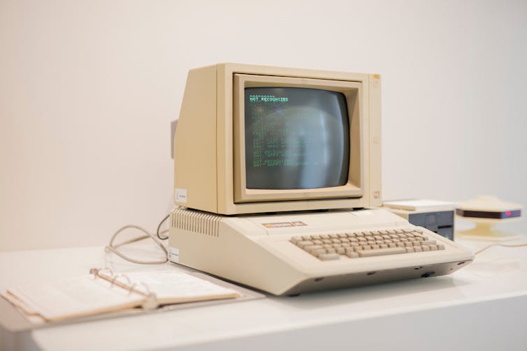 A vintage, boxed-shape white computer.