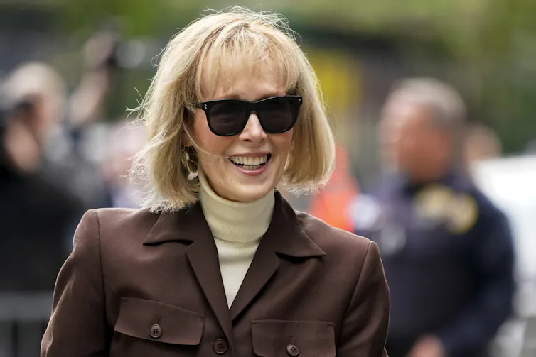 A woman with a blonde bob wearinng sunglasses.