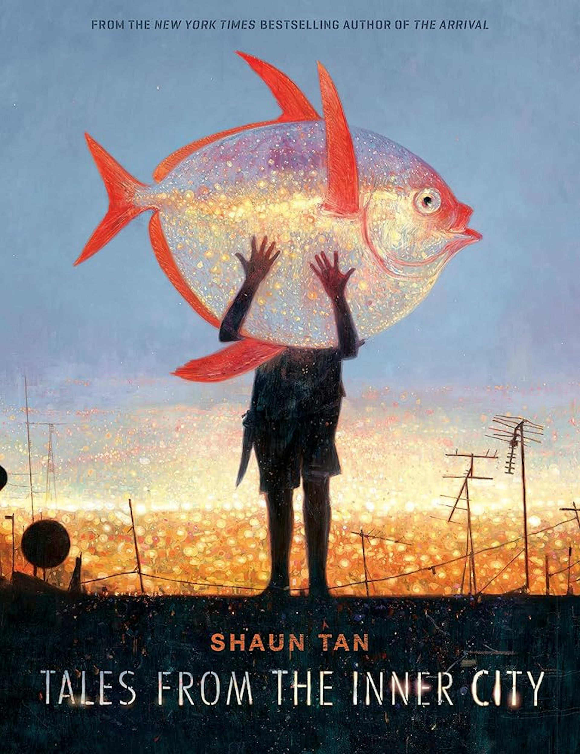 A man holding a giant fish on the cover of Tales From the Inner City