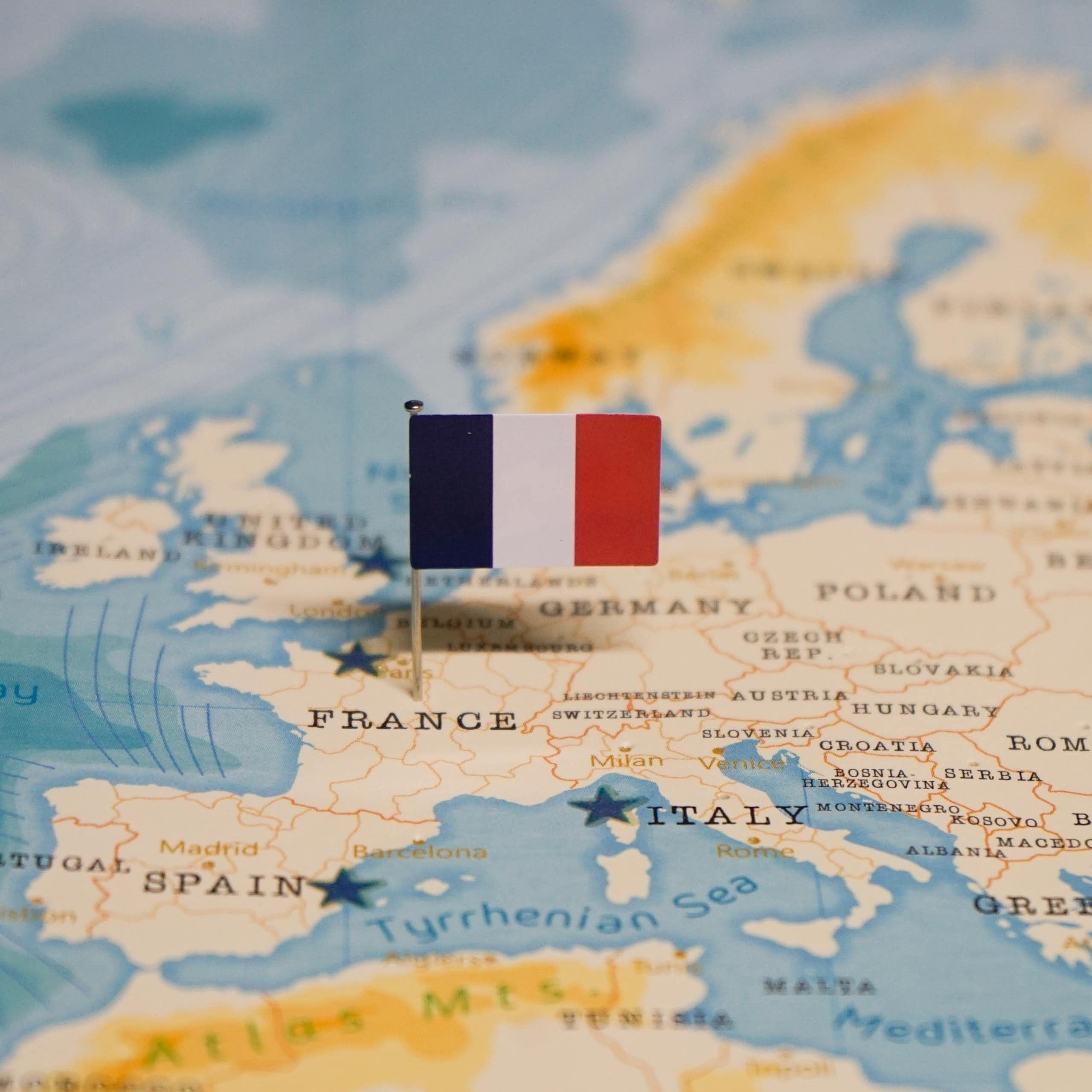 A map with a French flag pinned into France.