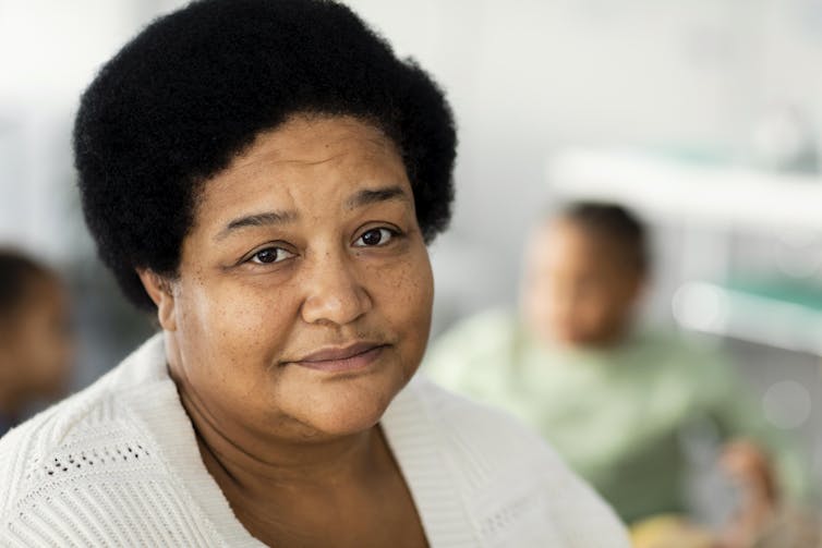 Close-up of a middle-aged woman looking at the camera