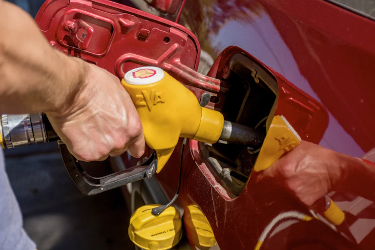 Person filling car up with fuel