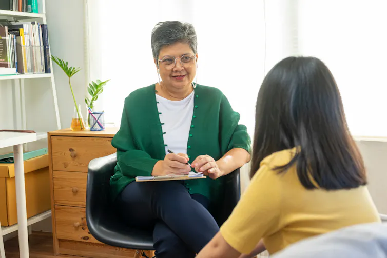 Therapist talks to client