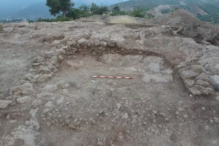 An archaeological site with an area dug out.