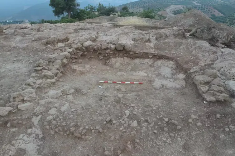 An archaeological site with an area dug out.
