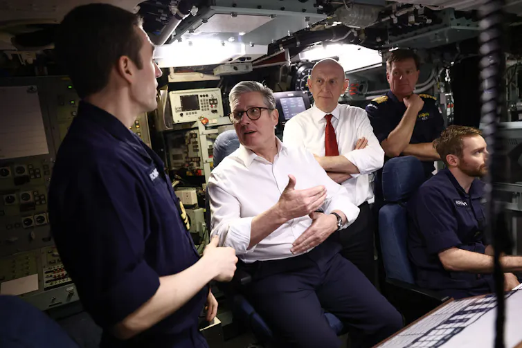 Keir Starmer on a submarine talking to crew.