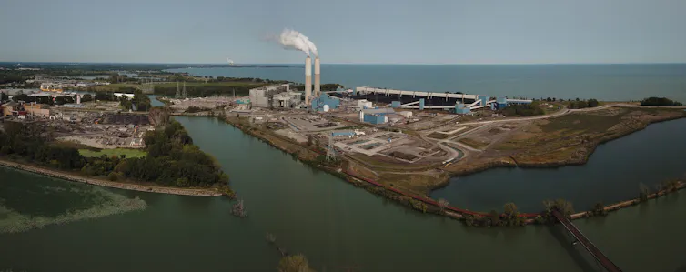 coal power plant on shore of large lake