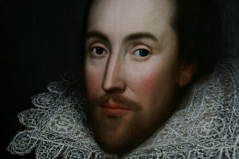 Painted portrait of a man with trim beard wearing lace collar.