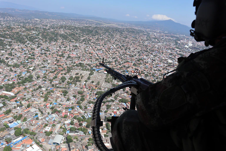Colombian security forces fly over the city of Catatumbo.