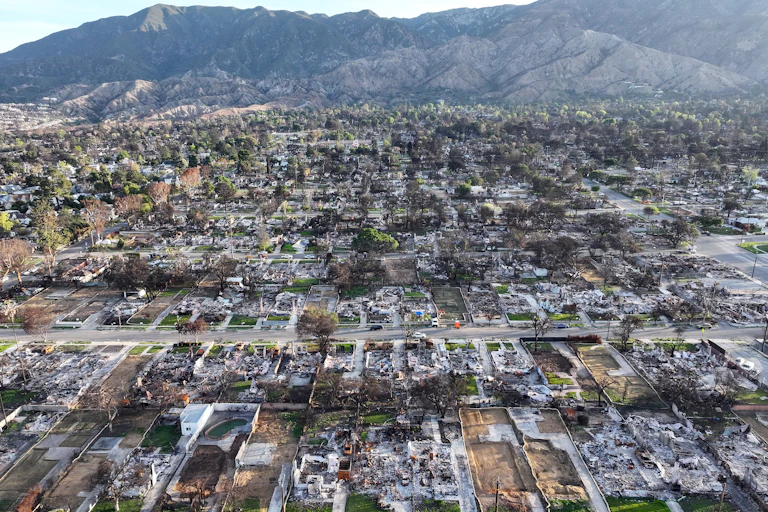 Aerial shot of fire-destroyed city, block after charred block