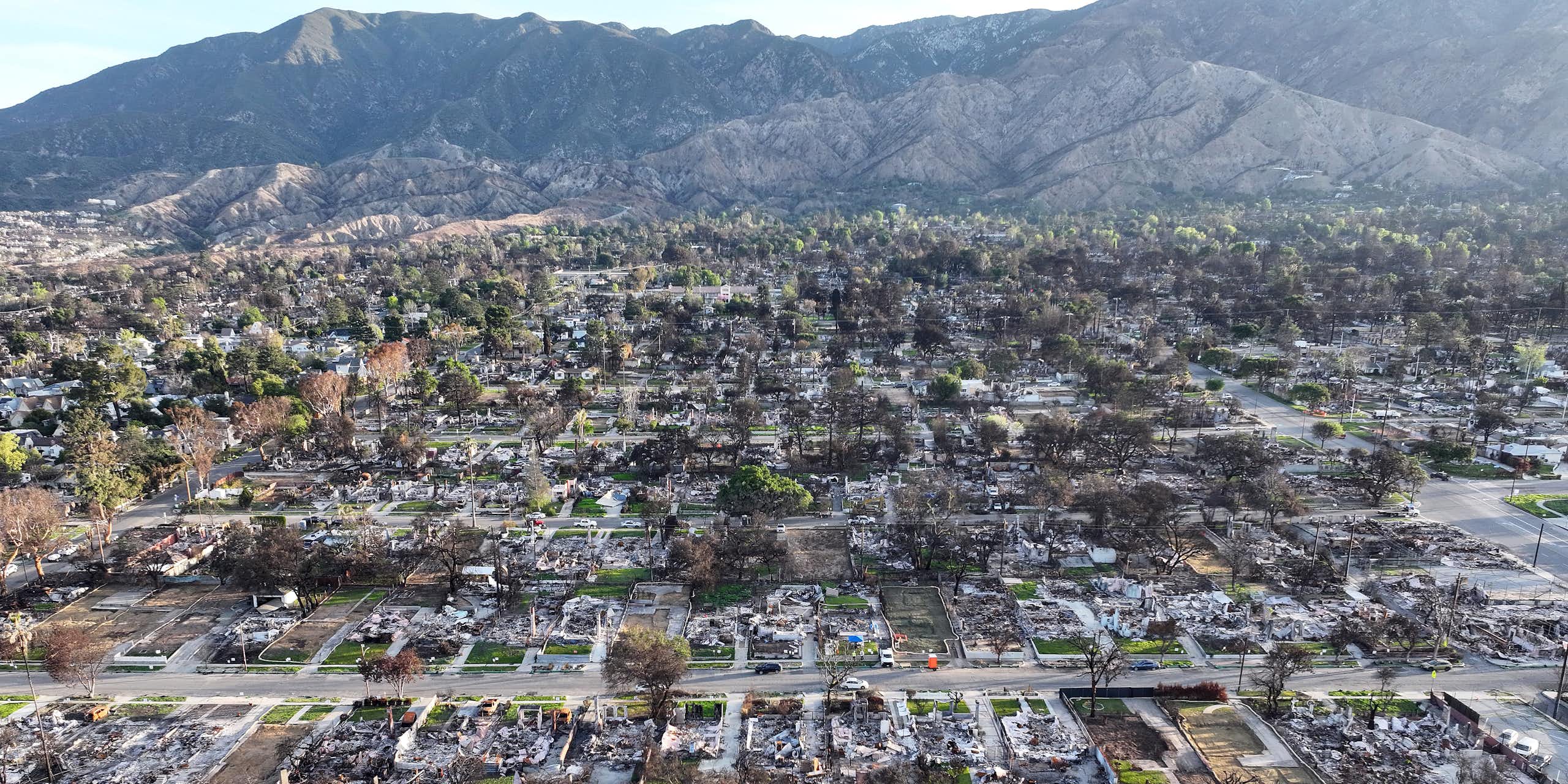 Aerial shot of fire-destroyed city, block after charred block