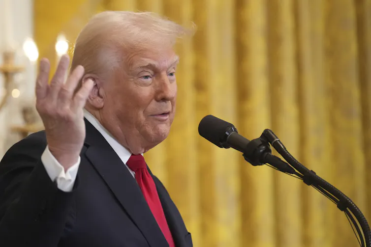 A man speaks into a microphone