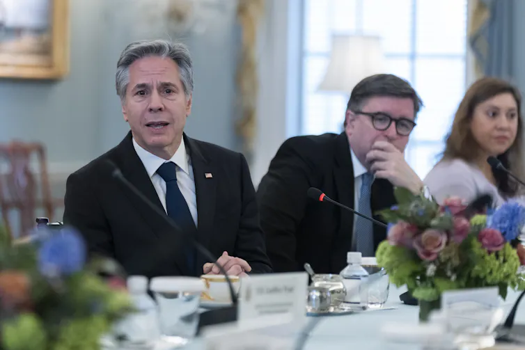 A man at a table appears troubled