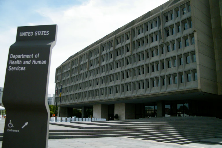 A grey big building housing the Department of Health and Human Services