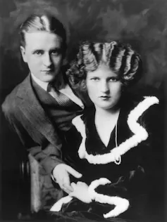 A suited man and beautiful woman