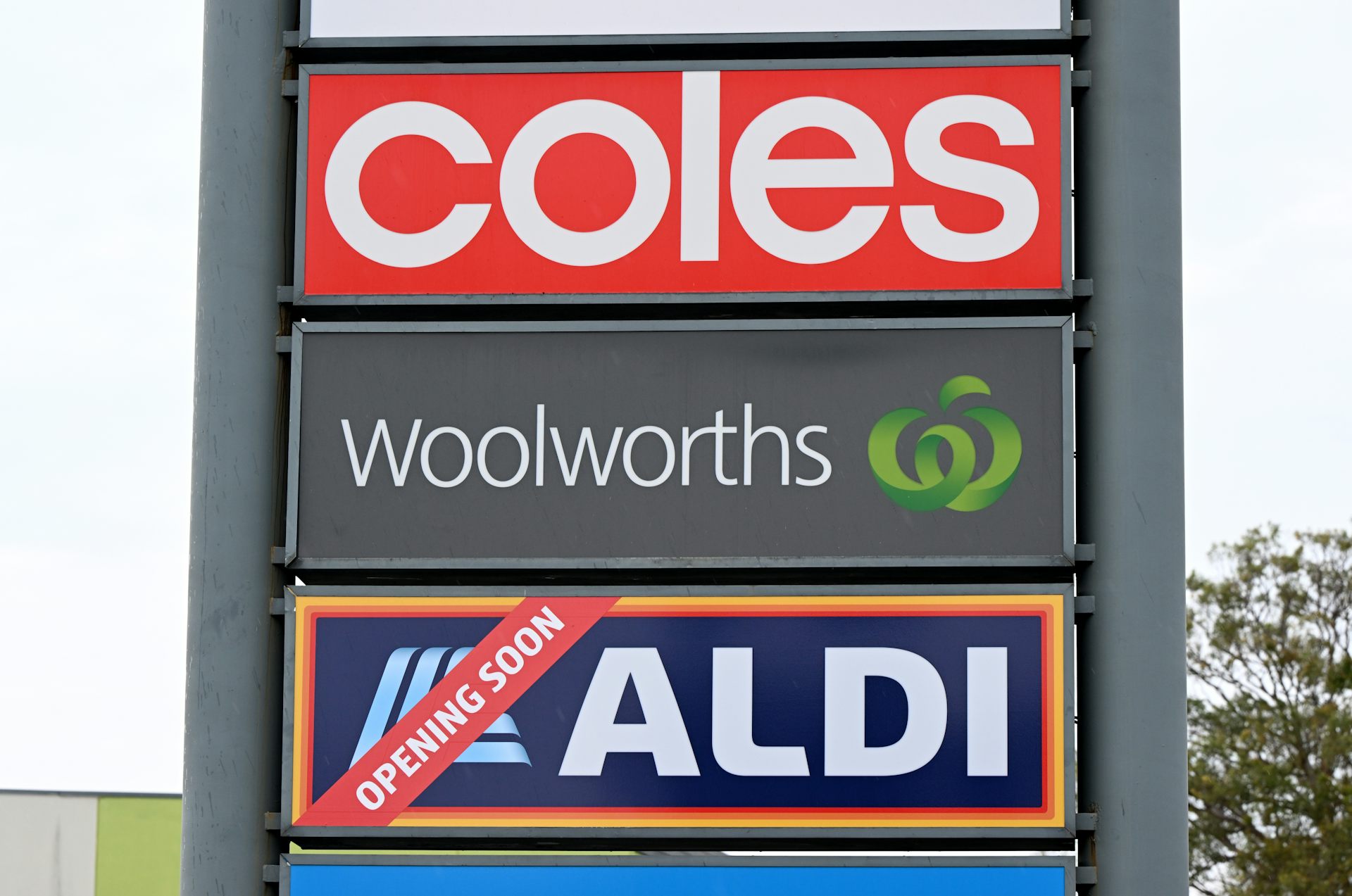 Signage for Australia’s three largest Supermarket companies Coles, Woolworths and Aldi
