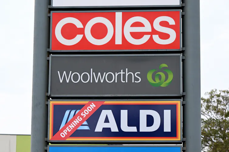 Signage for Australia’s three largest Supermarket companies Coles, Woolworths and Aldi