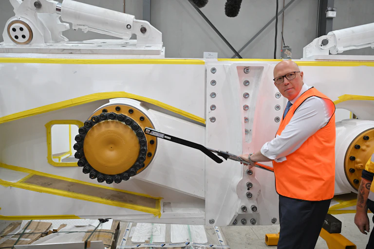 Leader of the Opposition Peter Dutton tightens a wheel nut during a visit to the Cougar Mining Equipment facility in Tomago in the Hunter Valley on day 3 of his 2025 Federal Election Campaign in the seat of Paterson, Monday, March 31, 2025.