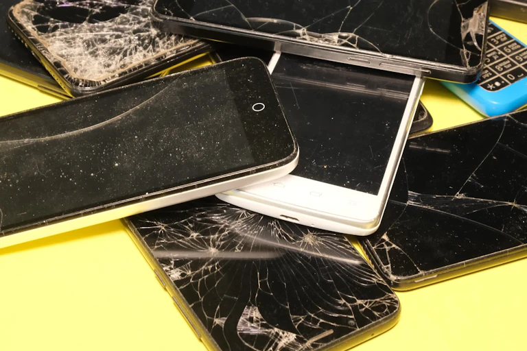 A bunch of broken smart phones.