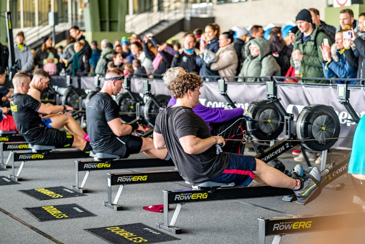 Male Hyrox competitors use rowing machines.