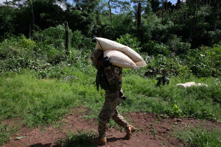 A Peruvian soldier participates in an operation to destroy a clandestine airstrip in the Amazon in 2022.