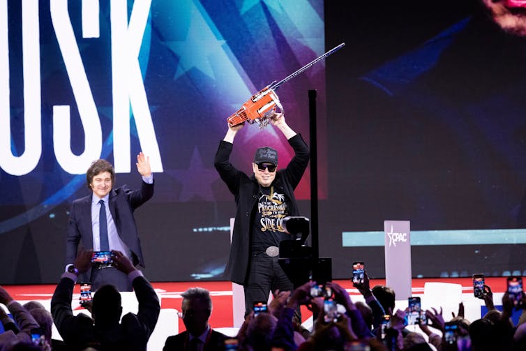 How memes unfold conspiracy theories – and what to believe earlier than sharing one 1 Musk, wearing a black Maga baseball cap and sunglasses, hoists a chainsaw over his head on stage, while Javier Milei waves behind him