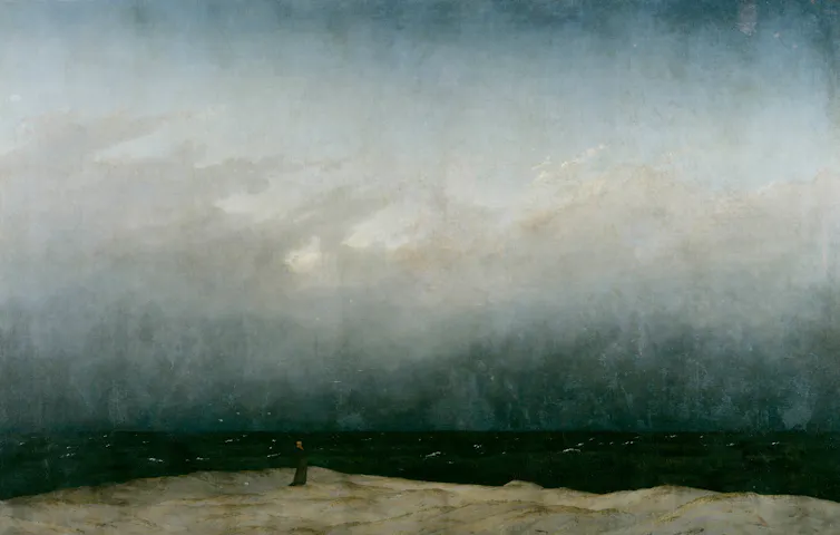 Painting of a man stood alone by the ocean