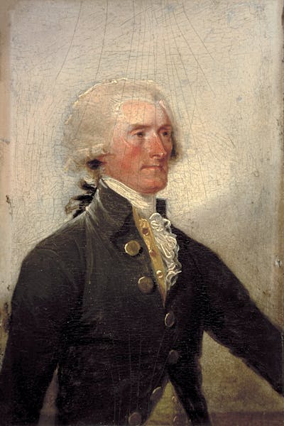 A man with white hair and a florid complexion, dressed in a fancy colonial jacket and shirt.