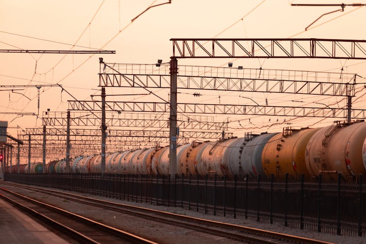 China is reshaping central Asia’s power sector as Russian affect fades 1 A freight train parked at a train station as dusk falls.