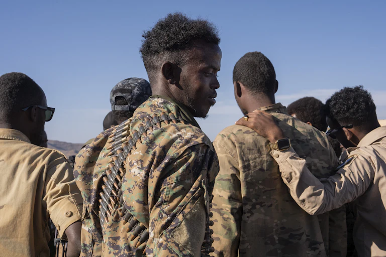 A group of men wearing military fatigues.