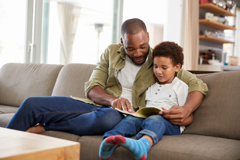 A father reading to his young son