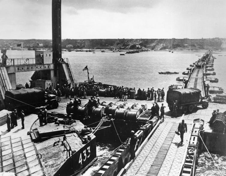 A pier unloading military supplies.