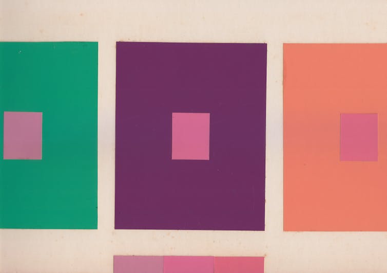 Green, purple and orange squares with smaller squares in shades of pink placed at their centers and at the bottom of the image